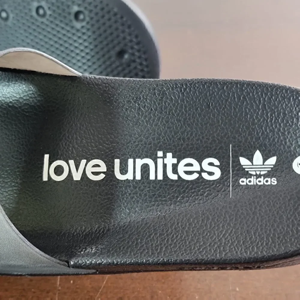 Adidas Original Adilette Limited Edition Love Unites Black Translucent Unisex